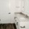 Bath with dual vanity, large mirror and glass enclosed shower