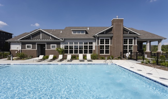 Pool Large pool with shaded seating and clubhouse access.