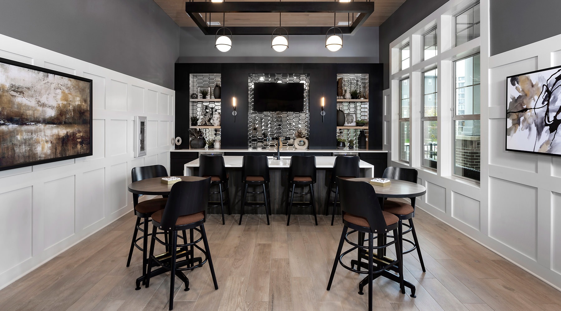 Clubhouse Resident clubhouse with ample seating, fireplace, demo kitchen and TVs